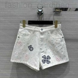 Kobiety damskie Designer 23SS Odzież ciężka rzemiosło Camellia wydrążona haftowane dżinsowe ubrania dla kobiet wysokiej jakości LM1X