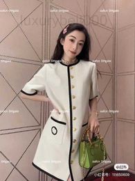 Women's Blouses & Shirts Designer 23ss Luxury Dress Elegant Ribbon Splice Round Neck Short Sleeve Metal Belt Knitted Fabric Design SEYV