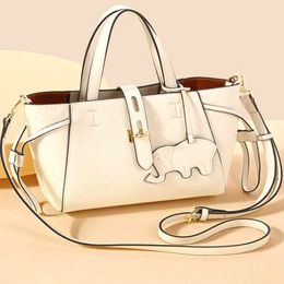The new mini single shoulder female baotou layer cowhide tote bag simple everything basket crossbody bag