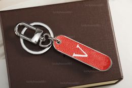 2023 stainless steel designer key chain couple pendant Kick scooter handmade leather mens and womens bag accessories 4 color party gift is very fashionable