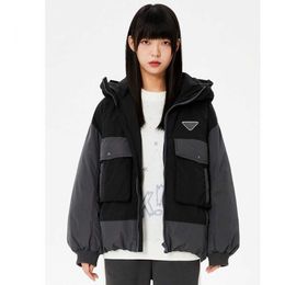 Autumn and winter women hooded splicing cargo down coat, big pockets fashion and practical, splicing Colour sports wind full, lovers coat.