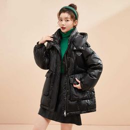 Autumn and winter ladies hooded waist down coat, white duck down filled fluffy full light, pull rope waist slim-fit version fashion.