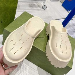 Womens platform perforated sandal evolves every season here monograms take the form of a cutout pattern on these white rubber sandals foam
