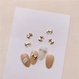 Nail Art Decorations 100 pieces/batch Mini Bow Knot Metal Nail Decoration Korean Rose Gold 3D DIY Handle Ribbon Gold Bow Knot Alloy Nail Decoration 230718