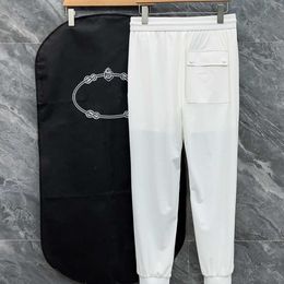 Spring and summer men's ice silk pants small foot pants, elastic lace-up long pants, ice silk cool and quick drying, casual fashion.