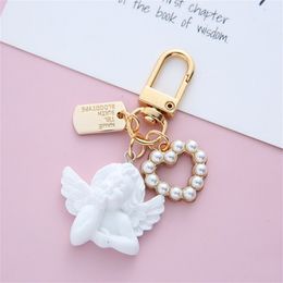 Vintage Little Angel Keychain Pearl Love Heart Pendant for Women Headphone Case Charm Exquisite Wedding Jewelry Gift Accessories