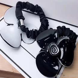 6 5CM black and white Acrylic hair ring Camellia rubber bands head rope for Ladys collection Fashion classic Items Jewelry headdre303l