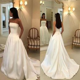 2021 Strapless Wedding Dresses with Pockets Bowtie with Sweep Train Satin A Line Wedding Bridal Gowns341Y