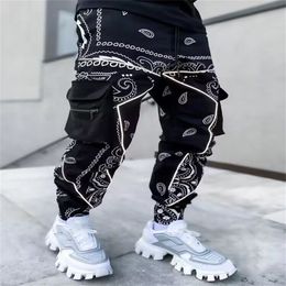 Men s Pants 2023 printed casual pants Haren men Europe and America loose high street multi bag cargo small feet hip hop 230721