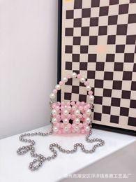 A niche 2022 new mini earphone carrying crossbody bag, acrylic pink beads, handmade beaded bag 230725