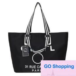 Duffel Bags Luxury Designer Black white Shopping Bags Women Triangle Label Waterproof Leisure Travel Bag Large Capacity Nylon Mommy Tote