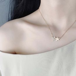 Fashion design Strands Four-leaf double flower necklace S925 silver thick gold electroplated super champagne gold simple exquisite necklace