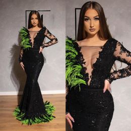 2019 Black Long Sleeves Prom Dresses Sexy See Through Sheer Deep V Neck Mermaid Dresses Feather Lace Appliques Pageant Gowns259f