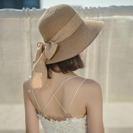 Cappelli a tesa larga Cappello di paglia da donna francese Summer Beach Versione coreana Cappellino da mare Cappello da sole pieghevole Protezione solare