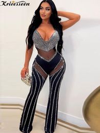 Women's Jumpsuits Rompers Kricesseen Sexy Black Crystal Mesh Patchwork Long Pant Jumpsuit Women Strap Deep V Neck See Throught Rompers Clubwear Outfits 230331