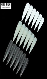 Whole 500pcs Stiletto Long False Fake Nails Tips Manicure Artificial Nails Salon Half Cover Tips White Clear NaturalBeige 6761374