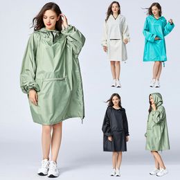 Raincoats Women's fashionable waterproof poncho raincoat with hooded sleeves and large pockets on the front. 230404