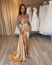 Formal 2023 Prom Dresses Sexy Gold Long Sleeves Off the Shoulder Pleated Sheath Satin Crystal Beads Evening Gowns Floor Length Side Split