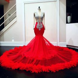 2023 Luxury Red Feathers Mermaid Prom Dresses Crystals Beaded Sheer Backless Long Sleeves Sexy Pageant Engagement Dress For Black Girls Women