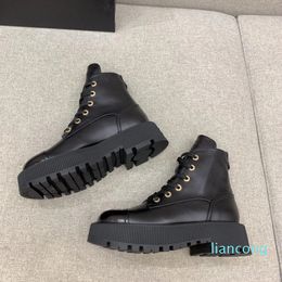 Luxury heavy-soled biker ankle boots leg lines with cowhide hardware lettering