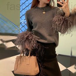 Women's Sweaters designer P Family Round Neck Sweater 2023 Autumn/Winter Elegant High end Design Sense Small Group Spliced Feather Knitted Top Skirt IQP0