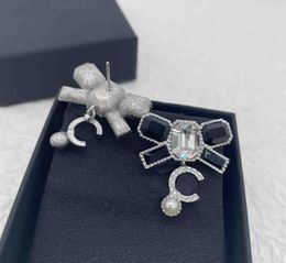 Luxury quality charm drop earring with butterfly shape design and black white colord diamond in silver plated have stamp box PS4715A