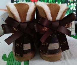 Hot sell AUS classical Design L Bow U boots women snow bowknot keep warm short winter Genuine Leather Sheepskin plush Fashion shoes