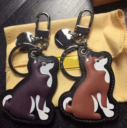 Keychains Lanyards Fashion Chai dog Luxury Designer Calfskin Leather Key Chain Laser Embossed Bag Pendants With Box Motion current 66ess