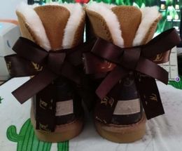 Hot sell AUS classical Design L Bow U boots snow bowknot keep warm short winter Genuine Leather Sheepskin plush