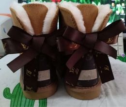 Hot sell AUS classical Design L Bow U boots women snow bowknot keep warm short winter Genuine Leather Sheepskin plush portability simple