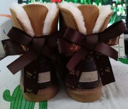 Hot sell AUS classical Design L Bow U boots women snow bowknot keep warm short winter Genuine gs Leather Sheepskin plush fallow rise