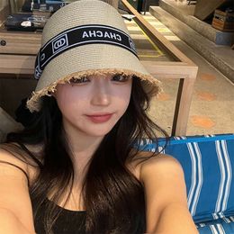 Fur brimmed straw for women in summer 2023 sun protection shading seaside beach vacation new small fragrant grass woven fisherman hat