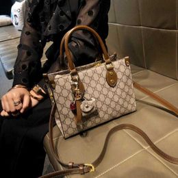 60% OFF 2024 Designer handbag Hong Kong Women's Crossbody New Popular Commuter Handheld Small Genuine Leather One Shoulder Tote Bag Trend