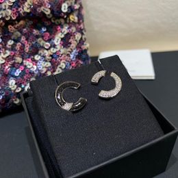 Luxury quality charm stud earring with sparkly diamond and black Colour enamel in silver plated have stamp box PS4900A