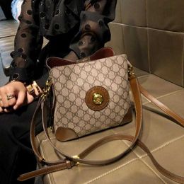 60% OFF 2024 Designer handbag Hong Kong Women's New Popular Texture Handheld Small One Shoulder Oblique Cross Leather Bucket Bag Tide