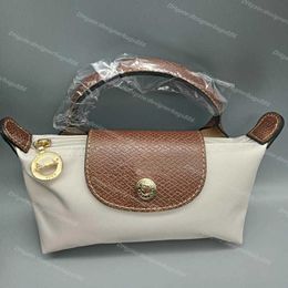 Yüksek kaliteli toptan çanta kadın cüzdan 2024 stil tek omuzlu çizgili mini hamur tatlısı taze çizgili değişim moda mobil naylon çantalar tasarımcı çantalar çanta çanta