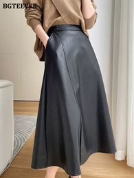 Skirts BGTEEVER Spring Autumn Elastic Waist Female A-line PU Skirts Elegant Loose Solid Faux Leather Skirts Women 230418