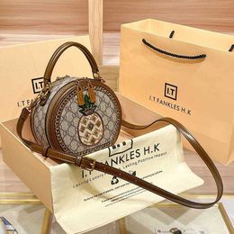 Designer handbag Hong Kong OEM Genuine Leather Women's New Fashion This Year Pineapple Embroidery Small Round Versatile One Shoulder Diagonal Straddle Bag