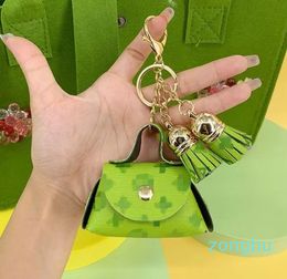 Designer leather small bag Keychain Fashion storage earphone bag Pendant Car chain Charm Brown Flower mini bag Accessories Gift Accessories