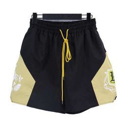 Designer Clothing short casual Rhude High Street Summer Men's Coconut Tree Letter Contrast Sports Casual Beach Nylon Shorts Trend Couples Joggers Sportswear