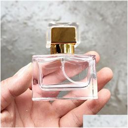 Packing Bottles High Quality 30Ml Flat Square Per Bottle Clear Glass Spray With Golden Cap Dhs W0162 Drop Delivery Office School Bus Dhflq