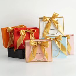 Pendant Necklaces 50PcsLot Custom Paper Handle Bag with Gold Bowknot Jewellery Dust Proof Box Wedding Birthday Christmas Candy Gift Organiser 231123