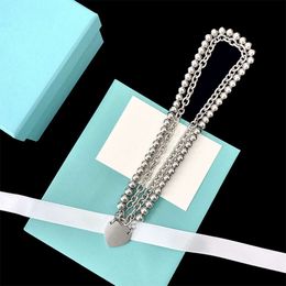 New listed trendy punk style home bead thick chain hanging love double ring overlapping titanium steel non fading Necklace