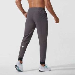 Lulus hızlı kuru çizim sporu cepleri eşofmanlar erkekler rahat pantolonlar erkek rahat elastik bel pantolon yoga marka kıyafeti spor 949i