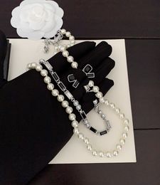 The latest black and white diamond bow double-layer pearl necklace is made of consistent ZP brass material