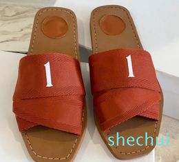 slippers sliders slides sandals woody flat mule The Maison's signature adorns the inner sole The easy slip-on design makes this flat a summer essentia