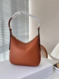 The new underarm bag features a unique half moon shaped design that is more casual and casual