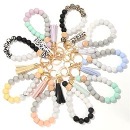 keychains for woman new food grade silicone bead key chain bracelet fashion wood bead bracelet key chain PU tassel anti-loss key ring designer bracelet