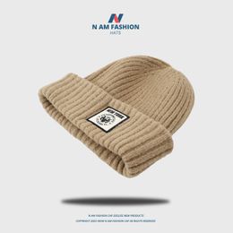 Ball Caps Korean version knitted hat for women American style street casual and versatile warm ear protection Woollen hat for men cold hat pullover hat 230626