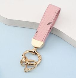 Designer PU Leather leather keychain with Flower Grid for Creative Presbyopia - Fashionable Car Keyring Holder and Bag Pendant Jewelry Accessory